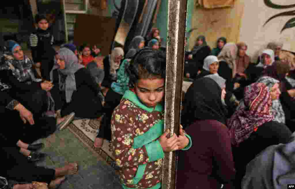 Relatives of Zakaria al-Kafarneh, who was killed during clashes with Israeli troops, mourn during his funeral in Beit Hanoun in the northern Gaza Strip.