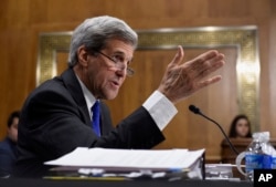 FILE - Secretary of State John Kerry promises a decision soon on whether the Islamic State is committing genocide.