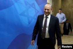Israeli Education Minister and head of the Jewish Home right-wing party Naftali Bennett arrives to the weekly cabinet meeting at Prime Minister Benjamin Netanyahu's Jerusalem office December 4, 2016.