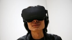 In this file photo, Peijun Guo wears the Oculus Rift VR headset at the Oculus booth at CES International in Las Vegas, Jan. 6, 2016. (AP)