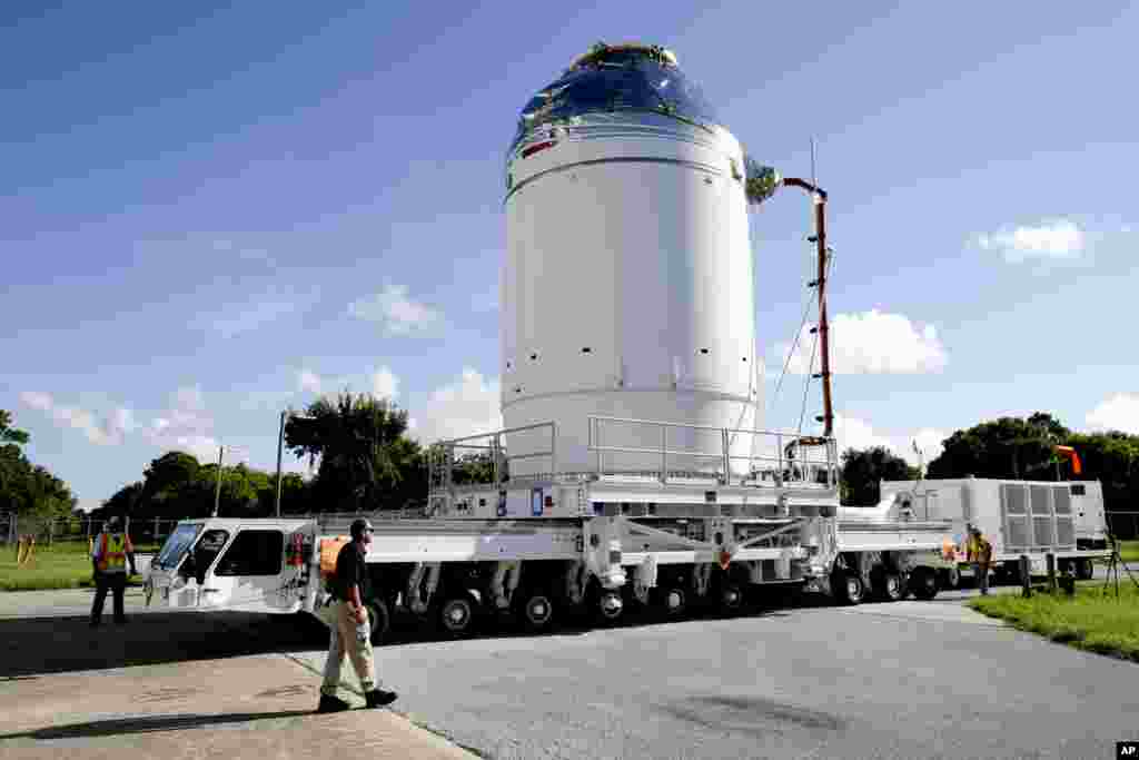 NASA's Orion spacecraft, preparing for it's first flight, moves toward the Payload Hazardous Servicing Facility at the Kennedy Space Center in Cape Canaveral, Fla. Orion is scheduled for a test flight in early December.