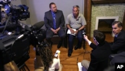 FILE - Mexican journalist Emilio Gutierrez Soto, top right, and his attorney meet with journalists following his release from detention in El Paso, Texas, Jan. 30, 2009. The 60-year-old fled with his son to the U.S.-Mexico border in 2008 seeking asylum in the United States.