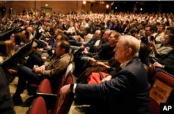 Former Vice President Al Gore, right, listens to introductory remarks for the film "An Inconvenient Sequel: Truth to Power," at the premiere of the film, Jan. 19, 2017, in Park City, Utah.