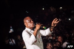 FILE - Democratic Republic of Congo joint opposition presidential candidate Martin Fayulu delivers a speech in front of his supporters in Beni, Dec. 5, 2018.