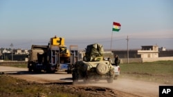 Kurdish peshmerga forces prepare for battle against the Islamic State group, near the Mosul Dam, in Iraq, Jan. 20, 2015.