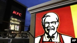 FILE - KFC says it plans to stop serving chicken raised with human antibiotics.