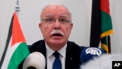 Palestinian Foreign Minister Riad Malki speaks during a press conference at the International Criminal Court in The Hagues, Netherlands, May 22, 2018. Malik said, Jan. 8, 2023, that Israel revoked his travel permit.