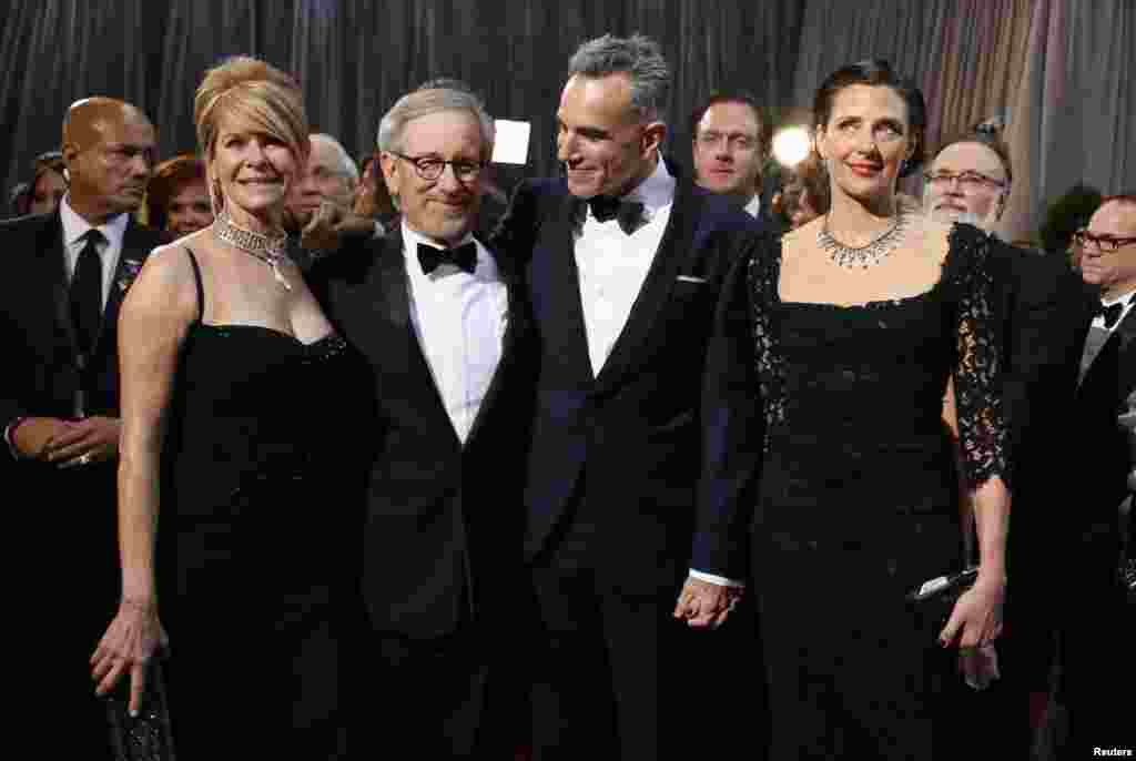 (L - R) Acrtess Kate Capshaw, her husband Steven Spielberg (2nd L), best director nominee for his film "Lincoln," British actor Daniel Day-Lewis (2nd R), best actor nominee for his role in "Lincoln" and his wife Rebecca Miller (R) pose at the 85th Academy