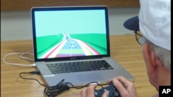 An elderly man plays a video game as part of a study at the University of California, San Francisco.. 