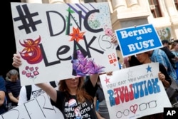 FILE - Demonstrators make their way around downtown Philadelphia during the first day of the Democratic National Convention, July 25, 2016. A day earlier, Debbie Wasserman Schultz, D-Fla., announced she would step down as DNC chairwoman.
