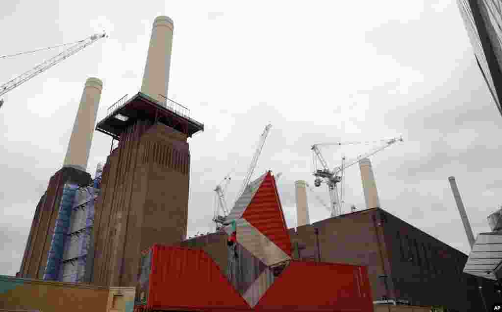 Satchie Noro performs a work entitled &#39;Origami&#39; which will open the London&#39;s Dance Umbrella festival, at a site next to the landmark four tower Battersea Power Station in London.