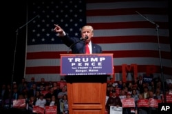 FILE - Republican presidential candidate Donald Trump speaks at a campaign rally in Bangor, Maine, Oct. 15, 2016.