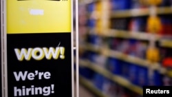 A sign is seen inside a Dollar General store in Chicago, Illinois, May 23, 2016. Economists will learn more about the health of the US economy next week when the unemployment rate for May is published
