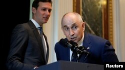 FILE - White House senior adviser Jared Kushner and Director of Strategic Initiatives Chris Liddell welcome technology company leaders to a summit of the American Technology Council at the Eisenhower Executive Office Building in Washington, June 19, 2017. 