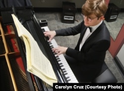 Georgy Tchaidze of Russia warms up in his dressing room before performing with the Brentano String Quartet on Thursday in the Final Round of the 15th Van Cliburn International Piano Competition.