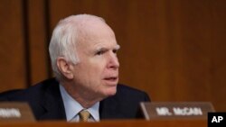 FILE - Senator John McCain, R-Ariz., questions former FBI Director James Comey during a Senate Intelligence Committee hearing on Capitol Hill, Thursday, June 8, 2017, in Washington. (AP Photo/Alex Brandon)