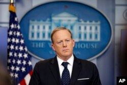 White House press secretary Sean Spicer listens to a reporter's question during a briefing at the White House, June 20, 2017 in Washington.