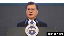 South Korean President Moon Jae-in speaks at the yearly news briefing on Jan. 10, 2018. He said he would be willing to meet with North Korean leader Kim Jong Un under the right conditions.