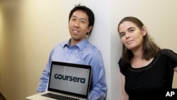Andrew Ng and Daphne Koller are Stanford University computer science professors who started Coursera. They posed for a photo in 2012. In March 2021, the company will offer shares for sale on the New York Stock Exchange. (AP Photo/Jeff Chiu)