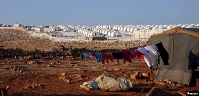 FILE - A general view of a refugee camp near Atimah village, Idlib province, Syria, Sept. 11, 2018.