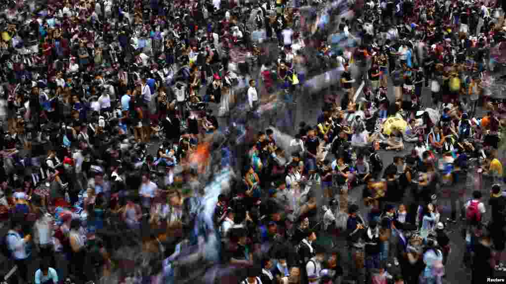 Protesters block the main street to the financial Central district, outside the government headquarters in Hong Kong, Sept. 29, 2014. 