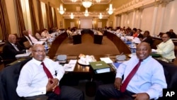 In this photo supplied by the South African Government Communications and Information Services (GCIS) South African President Jacob Zuma, left, and Deputy President Cyril Ramaphosa, right, with minsters and deputy ministers at a scheduled routine meeting of Cabinet Committees at parliament in Cape Town, South Africa, Wednesday, Feb. 7, 2018. 