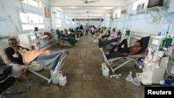 FILE - People with kidney failure undergo dialysis at a hospital in the Red Sea port city of Hodeidah, Yemen Nov. 28, 2018. 