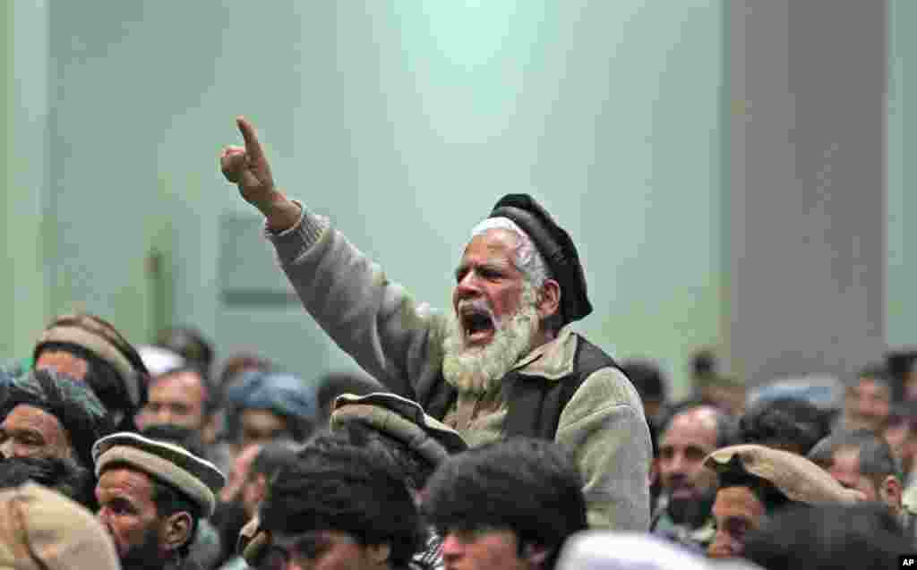 A supporter of Afghan presidential candidate Abdul Rasoul Sayyaf chants slogans during a campaign rally in Kabul, March 6, 2014.