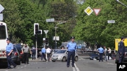 Policeman block the road near the scene of an explosion in Dnipropetrovsk, Ukraine, April 27, 2012.