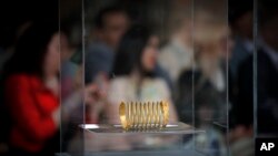 An ancient Dacian gold bracelet is displayed during a press conference at the national history museum in Bucharest, Romania, April 19, 2018. 