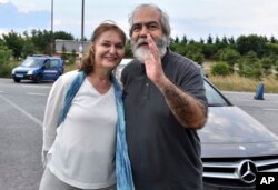 Mehmet Altan, a Turkish newspaper columnist and academic, and his wife Umit Altan, speak to the media after being released from the prison in Silivri, near Istanbul, June 27, 2018.