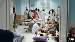 In this undated photograph released by Doctors Without Borders (MSF) on October 3, 2015, medical personnel treat injured civilians at the MSF hospital in Kunduz province, Afghanistan. MSF announced Saturday that it hopes to reopen the bombed hospital next year.
