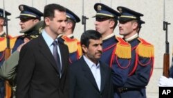 Syrian President Bashar al-Assad and Iranian President Mahmoud Ahmadinejad