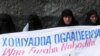 FILE - Ogaden National Liberation Front activists hold a banner in Mogadishu that reads, "The Ogaden freedom is the key to peace in the Horn of Africa," during a ceremony that marked the organization's 22nd anniversary in Somalia, Aug. 15, 2006.