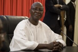 FILE - Burkina Faso's then-Prime Minister Christophe Joseph Marie Dabire attends the first cabinet meeting of the new government, at the presidential palace in Ouagadougou, Jan. 24, 2019.