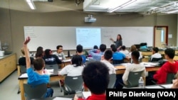 A teacher instructing students during a class at Basis Independent School in McLean, Virgnia