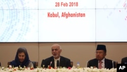 FILE - In this Wednesday, Feb. 28, 2018 file photo, Afghanistan's President Ashraf Ghani, center, speaks during the 2nd Kabul Process conference at the Presidential Palace in Kabul.