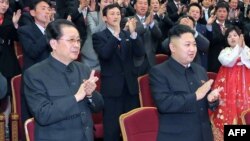 North Korean leader Kim Jong-Un (R) and his uncle Jang Song-Thaek (L) at the Unhasu orchestra concert in Pyongyang in April.