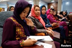 Afghan women attend a consultative grand assembly, known as Loya Jirga, in Kabul, Afghanistan, April 29, 2019.