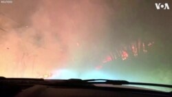 Car Drives Through Northern California Wildfire 