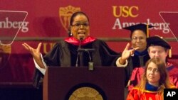 FILE - Oprah Winfrey speaks to graduates at USC's Annenberg School for Communication and Journalism at the Shrine Auditorium in Los Angeles, May 11, 2018.