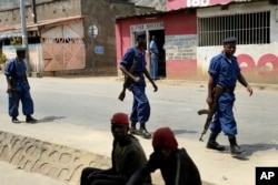 Policemen patrol the Musaga district of Bujumbura, Burundi, July 20, 2015.