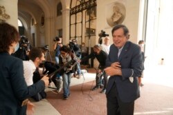 Italian theoretical physicist Giorgio Parisi speaks to journalists as he arrives at the Accademia dei Lincei , Tuesday, Oct. 5, 2021. (AP Photo/Domenico Stinellis)