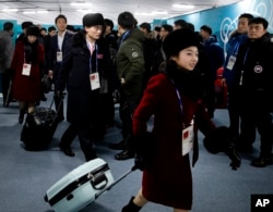 Members of the North Korean Olympic delegation arrive at the Olympic Village of the 2018 Winter Olympics in Gangneung, South Korea, Feb. 1, 2018.