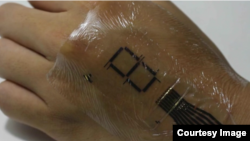 Japanese researchers have developed an e-skin that could one day revolutionize electronics, particularly biometric tracking. (Someya Laboratory)