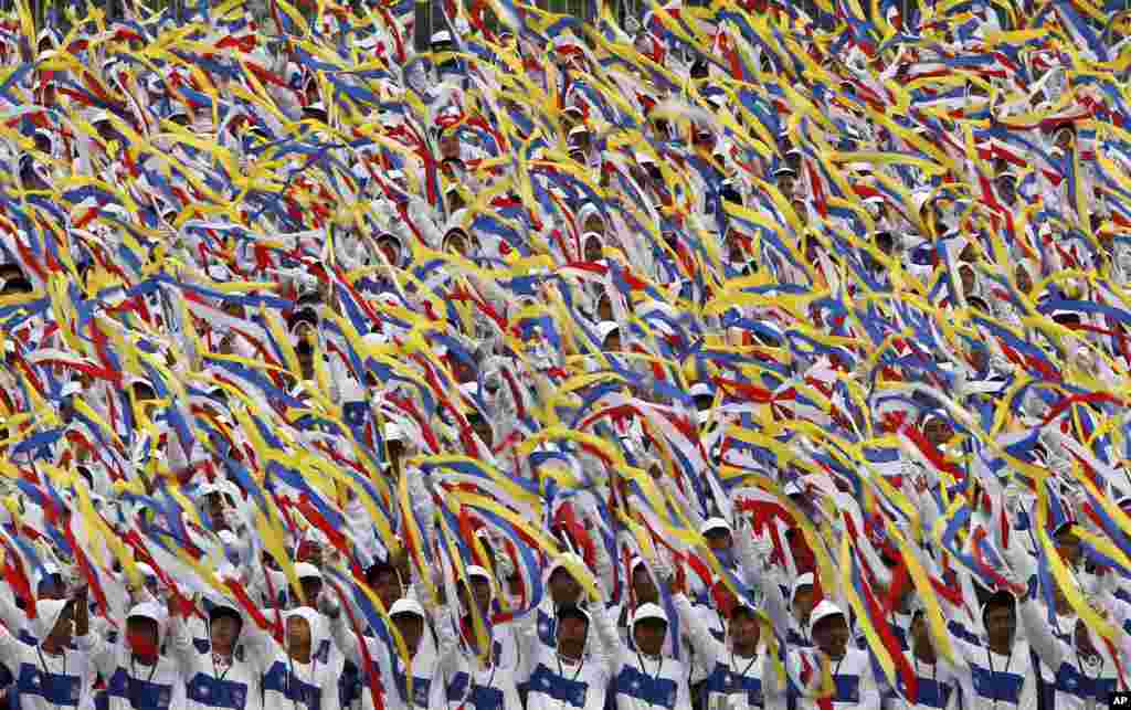 Malaysian students perform during the 56th National Day celebrations at Independence Square in Kuala Lumpur.