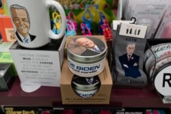 A display of President-elect Joe Biden and Jill Biden books and keepsakes including a scented candle, are available at Browseabout Books, Friday, Nov. 13, 2020, in Rehoboth Beach, Del. (AP Photo/Alex Brandon)