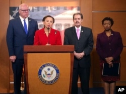 From left, New York Reps. Joe Crowley, Nydia Velazquez, Jose Serrano and Yvette Clarke talk about the damage in Puerto Rico caused by Hurricane Maria on Capitol Hill in Washington, Sept. 26, 2017.