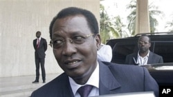 Security agents look on as Chad President Idriss Deby, center, enters a car, (File)