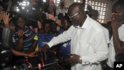 FILE - Former soccer star George Weah, presidential candidate for the Coalition for Democratic Change casts his vote during a presidential election in Monrovia, Liberia, Oct. 10, 2017.